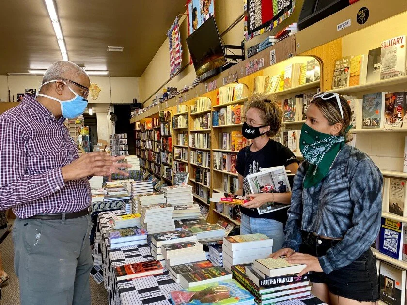 James Fugate speaking with customers at the Leimert Park store